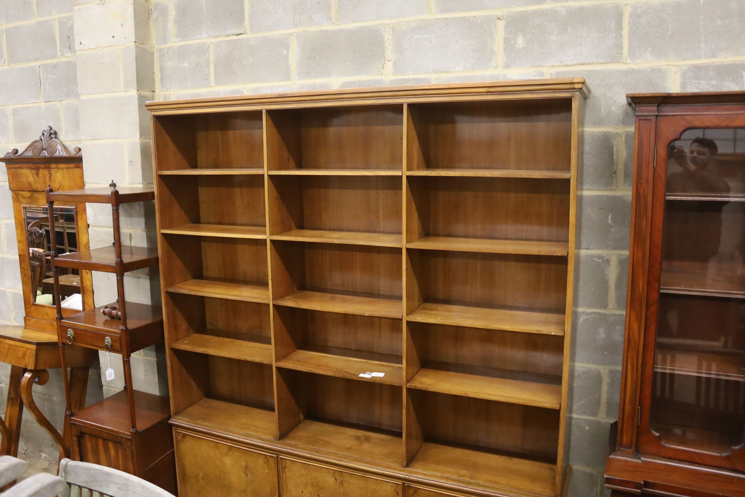 A mid century walnut open bookcase cupboard, length 186cm, depth 30cm, height 220cm
